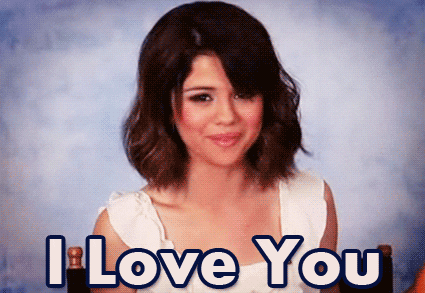 A gif of Selena Gomez blowing a kiss with the text ‘I Love You’